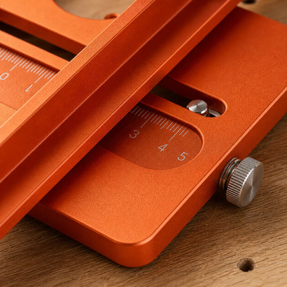 Close-up of the adjustable rail and engraved scale on the router jig